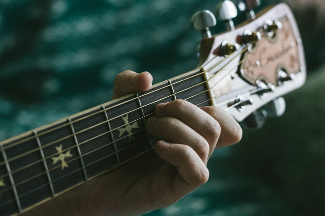 Person playing guitar